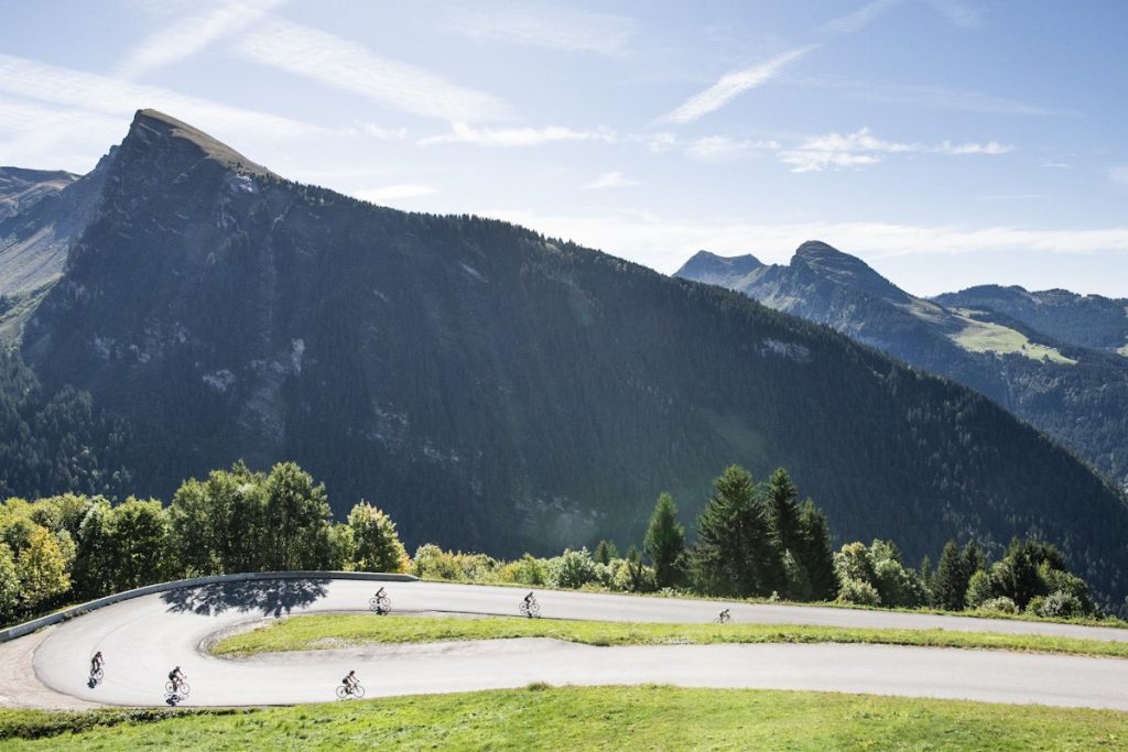 cyclists descend the Route de Avoriaz, one of the most famous road cycling routes around Morzine