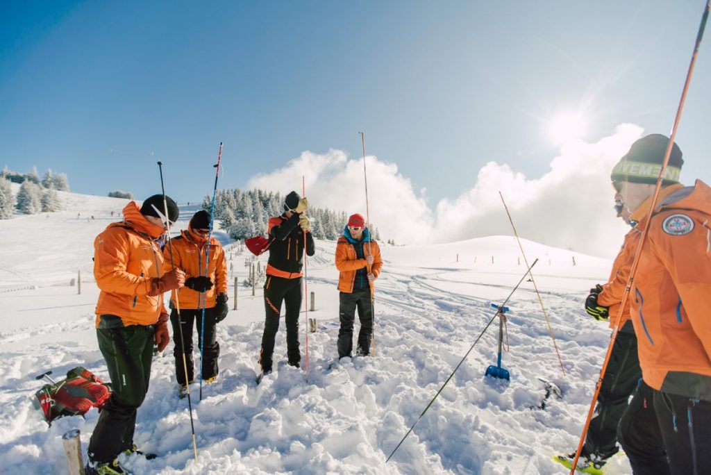 the secours en montagne team test the snow depth in Morzine