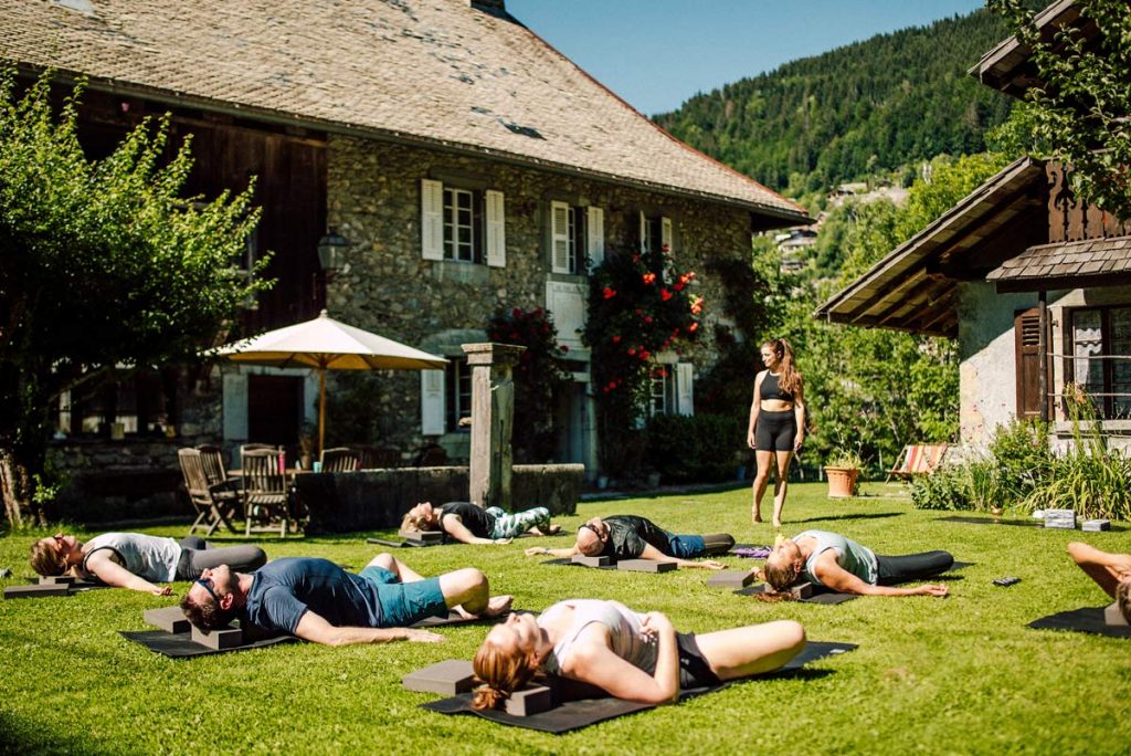 yoga class in the garden of the farmhouse morzine