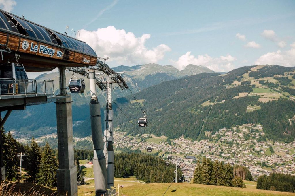 view of the telecabine Pleney in Morzine from the top and mountains
